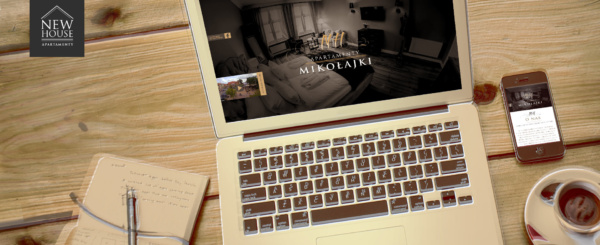 laptop i smartphone z otwartą stroną internetową apartamentów New House