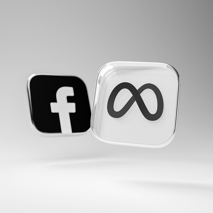 Ikony aplikacji Facebook i Meta w minimalistycznym stylu 3D na jasnym tle, przedstawione jako wypukłe kwadraty z zaokrąglonymi rogami.