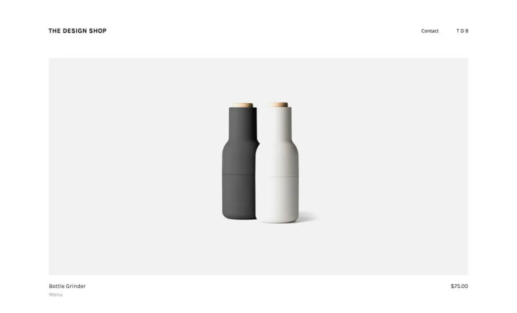 Minimalistyczna strona produktowa The Design Shop przedstawiająca zestaw nowoczesnych młynków do soli i pieprzu Bottle Grinder marki Menu