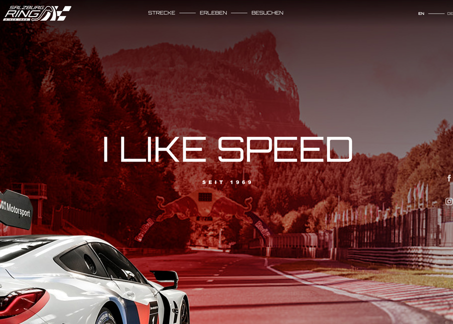 Strona internetowa toru wyścigowego Salzburg Ring z hasłem "I LIKE SPEED" oraz zdjęciem samochodu sportowego na tle górzystego krajobrazu